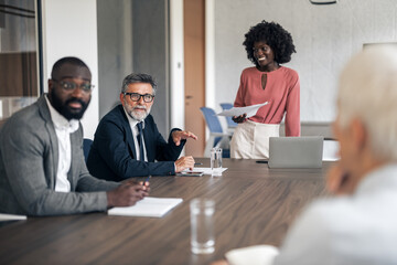Business partners having a meeting in a corporate conference room