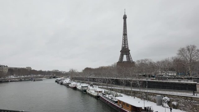Eiffel Tower with the docks with snow