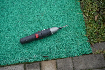 Cordless portable screwdriver top view. Small drill tool