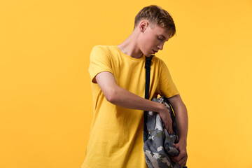 Backpack, youth and camouflage pattern being opened with a visible zipper, casual clothing and fashion accessory ready for daily outings. Practical storage and organized style for travel, school and