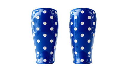Two blue shakers with white polka dots, isolated on a white background.