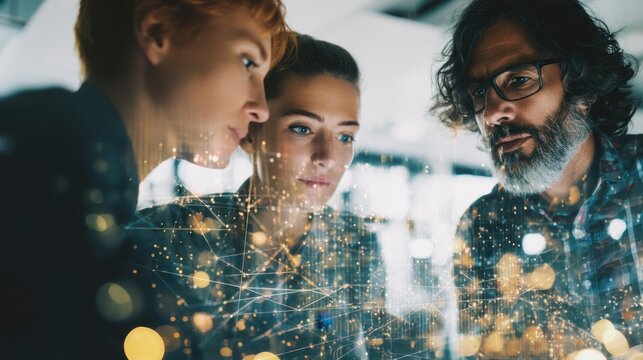 Three individuals focus on a digital display in an office setting. They engage in a work discussion analyzing data and ideas in front of them. The scene shows collaboration and teamwork. - Powered by Adobe