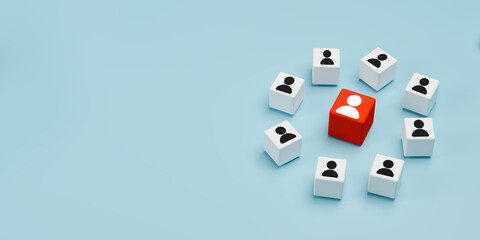 Leadership and standout concept with red human icon cube surrounded by white cubes.