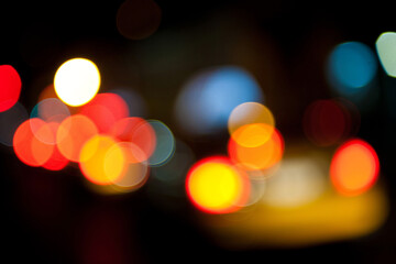 City Lights Bokeh: Vibrant orbs of light dance against a dark canvas, capturing the energy of a bustling city at night, with dynamic streaks and an abstract aura.
