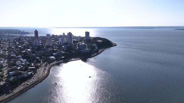 Large stainless steel statue of Andres Guacurari on the riverfront of Posadas. Cultural landmark in Misiones, Argentina.