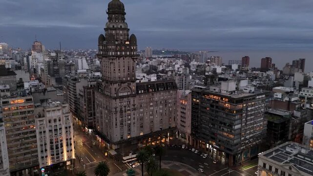 Illuminated Artigas Monument at Plaza Independencia. Night view of Montevideo's Old Town gate and historic district.
