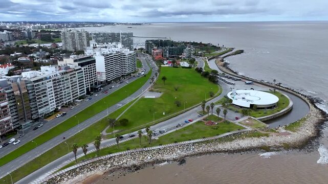 Iconic Montevideo city sign on the Rambla. Panoramic view of the beach and Rio de la Plata coastline in Uruguay.