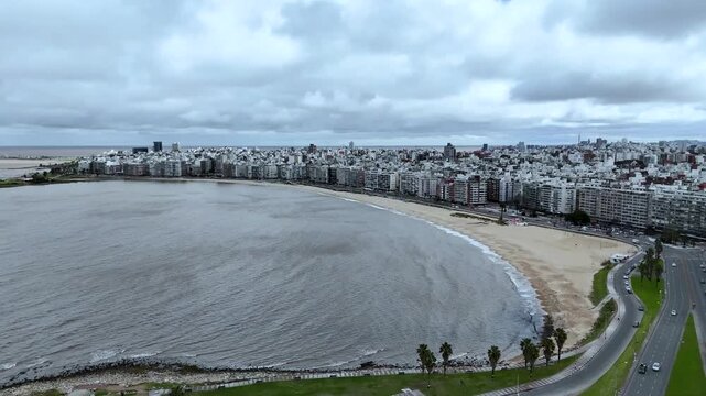 Iconic Montevideo city sign on the Rambla. Panoramic view of the beach and Rio de la Plata coastline in Uruguay.