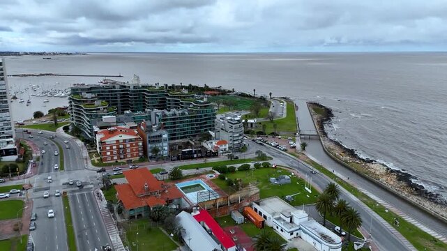 Iconic Montevideo city sign on the Rambla. Panoramic view of the beach and Rio de la Plata coastline in Uruguay.