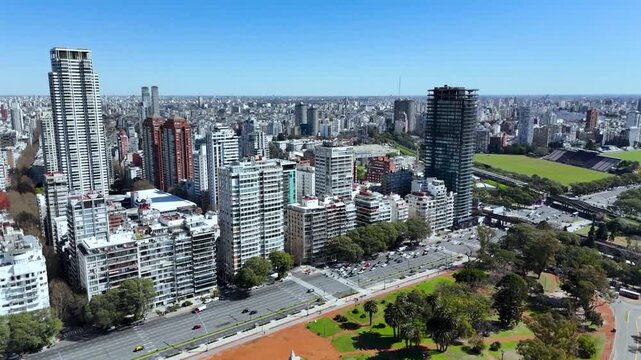 Tres de Febrero Park with lake and railway tracks. Buenos Aires city skyline and urban nature in Palermo district.