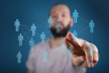 Close up of a man's hand interacting with a virtual network of connected people. Concept of...