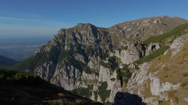 Aerial View of Gaura Glacial Valley Entrance Flanked by Gutanu and Lancia Peaks with Erosion Towers in Soft Autumn Light