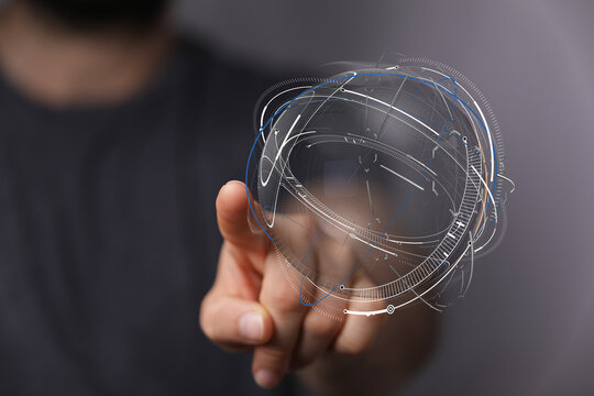 Concept of global network and digital connection. Hand touching a futuristic globe with network lines, representing technology, communication an - Powered by Adobe