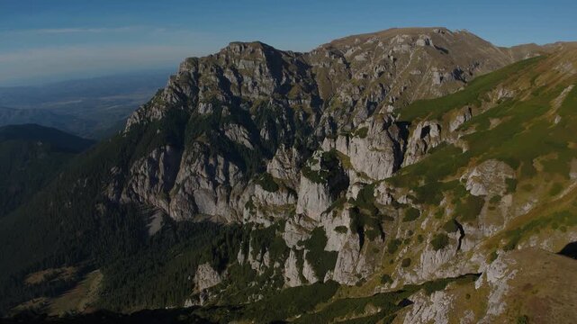 Aerial Panoramic Lateral Reveal of Gaura Valley Showing Lancia and Scara Peaks with Erosion Towers at Golden Hour