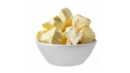A bowl of creamy butter chunks against a black background