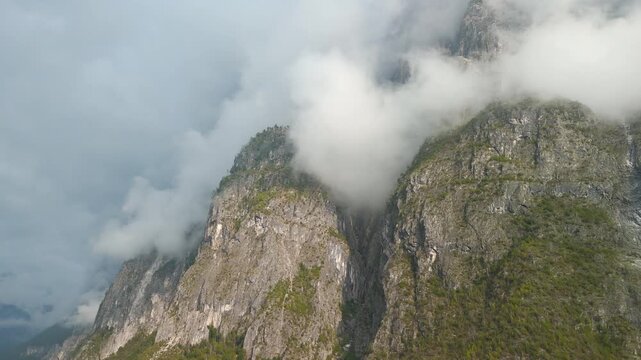 Atmospheric Dolomite mountain scenery with deep clouds in Italy