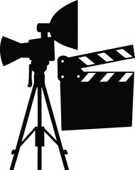 Professional film production equipment with a clapboard and studio light on tripod
