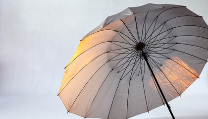 Colorful Umbrella Against Sky with Warm Sunset Light.