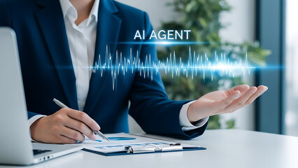 Businesswoman interacting with ai agent on computer at office desk with futuristic interface