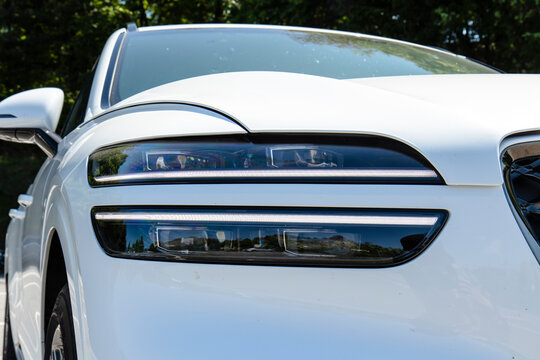May 9, 2021, Seoul, South Korea - Close-up of the front headlights of a white Genesis GV70 3.5T SUV