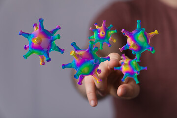 Abstract colorful virus illustration with a hand. Conceptual image for the topics of medicine,...
