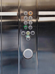 Close-up of Modern Elevator Control Panel with Illuminated Floor Buttons