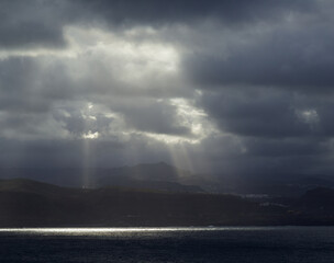 Sky over Gran Canaria, cloud cover with gaps, rays of sunshine