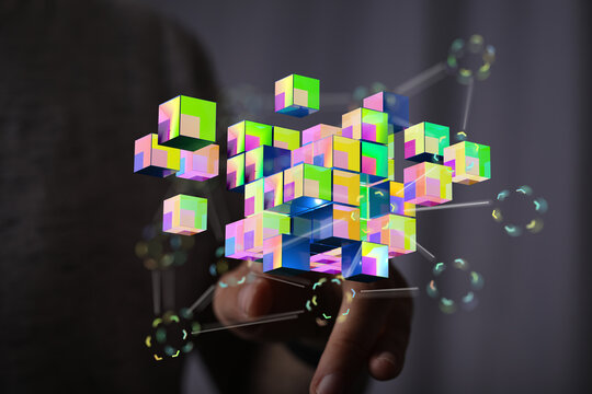 Abstract image showing a hand interacting with a collection of colorful digital cubes and connections. It illus - Powered by Adobe