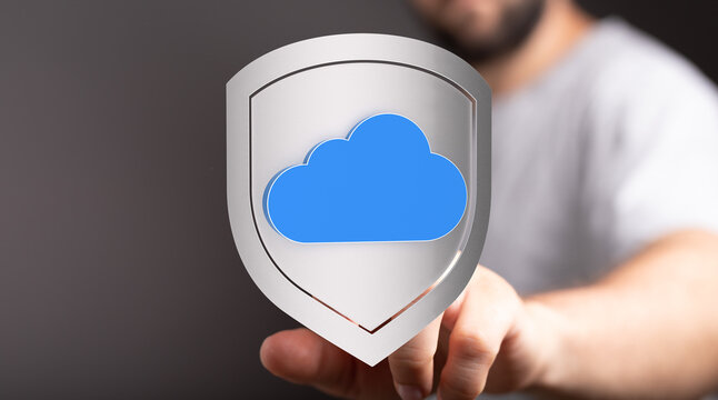 Hand pressing a digital cloud data protection shield. Illustrating cyber security, data privacy, cloud computing, and online safety. - Powered by Adobe