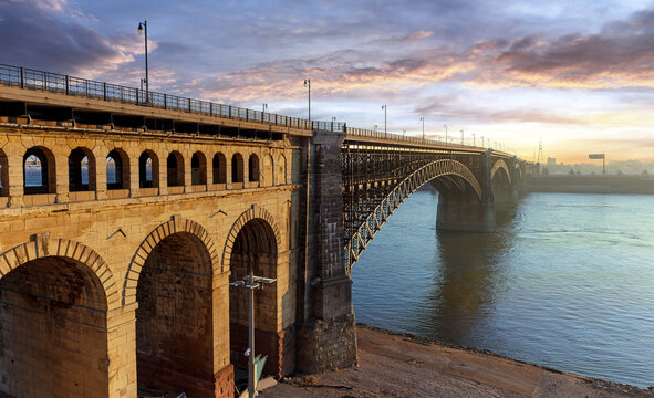 Scenic sunrise view of the Eads Bridge crossing the Mississippi River from St. Louis, MO to East St. Louis, IL