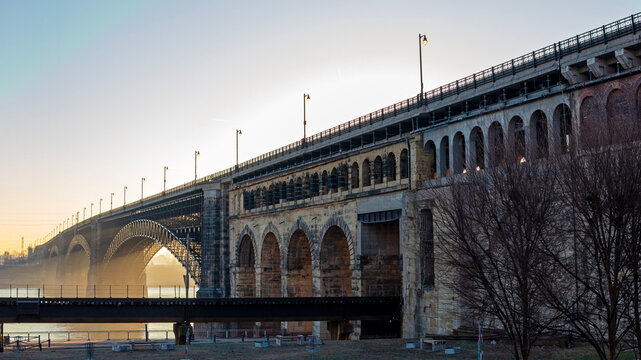 Scenic sunrise view of the Eads Bridge crossing the Mississippi River from St. Louis, MO to East St. Louis, IL