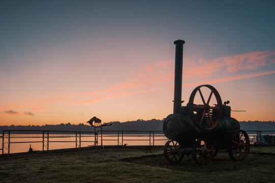Sunrise at Plazuela el Tren (Train Square) in Castro, Chilo? Island, Chile. The little square, famous Castro?s landmark, is named after an old steam locomotive installed in the gardens facing the sea.