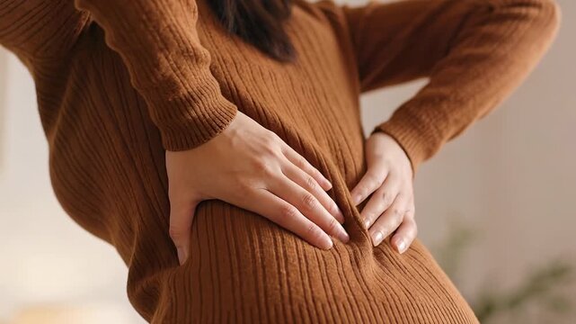 office syndrome in office worker concept, female touching her back suffering from muscle pain from sitting position during work.