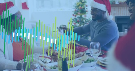 Fototapeta premium Pouring man wearing blue sweater serving wine at home dining room, Santa hats, waveform overlay