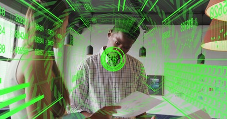 Holding central man in plaid shirt reading printed documents at office table, with green HUD