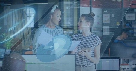 Talking staff in blue blouse and checked top sharing papers and tablet in office, HUD overlay