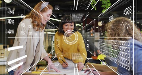 Reviewing team of four leaning over printed plans in modern office, yellow sweater and AR overlays
