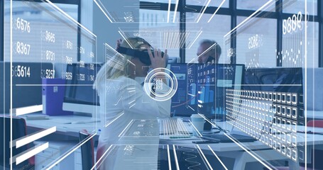 Adjusting woman in white blazer wearing VR headset at desk, showing monitors and AR HUD