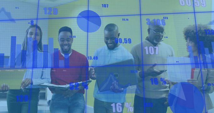 Reviewing data team of five coworkers at multipanel display in business-casual office with reports - Powered by Adobe