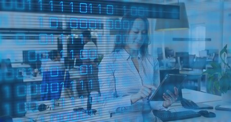 Tapping Korean woman wearing light blouse holding tablet in open office, binary overlay