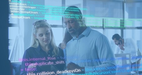 Pointing lead in blue shirt guiding woman in polo, examining tablet in office with glass code