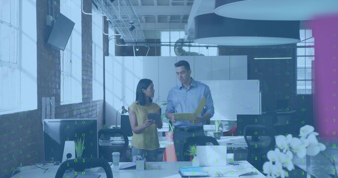 Talking blue-shirted man and yellow-blouse woman reviewing papers in loft office with yellow folder - Powered by Adobe