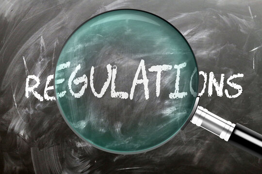 Regulations - learn, study and inspect it. Taking a closer look at regulations. A magnifying glass enlarging word 'regulations' written on a blackboard ,3d illustration