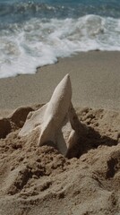 Whimsical sand shark breaches through grains, echoing Jaws nostalgia, beach-combing adventures, and National Beach Day celebrations