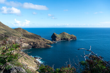 Fototapeta premium Cliffs and coastline of Taiohae Bay in Nuku Hiva, Marquesas Islands, French Polynesia
