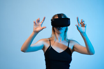 Woman adjusting virtual reality headset during immersive gaming session, modern VR technology and digital entertainment concept
