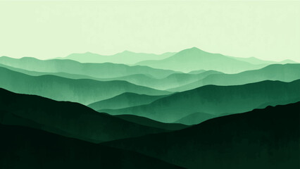 Misty blue mountain landscape at sunrise featuring a forest valley and cloud covered peaks under a glowing horizon