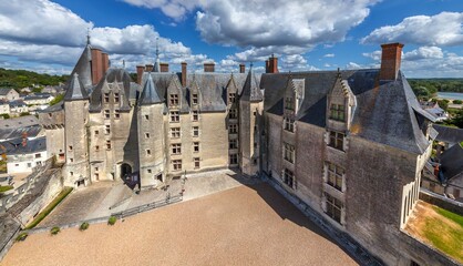 Aerial view of the majestic Chateau de Chaumont, its stone walls bathed in sunlight, a testament to French history under a bright sky, Chaumont-sur-Loire, Centre-Val de Loire, France.