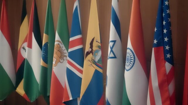 Flags of different countries in the 50s and 60s gathered to sign important interstate treaties. Shot in motion