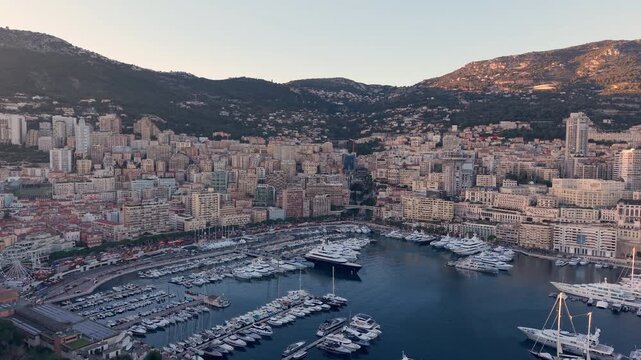 Sunset Harbor Scene, Luxurious Yachts By Sunset, Peaceful Marina With Hillside And City View. Monaco. Monte carlo